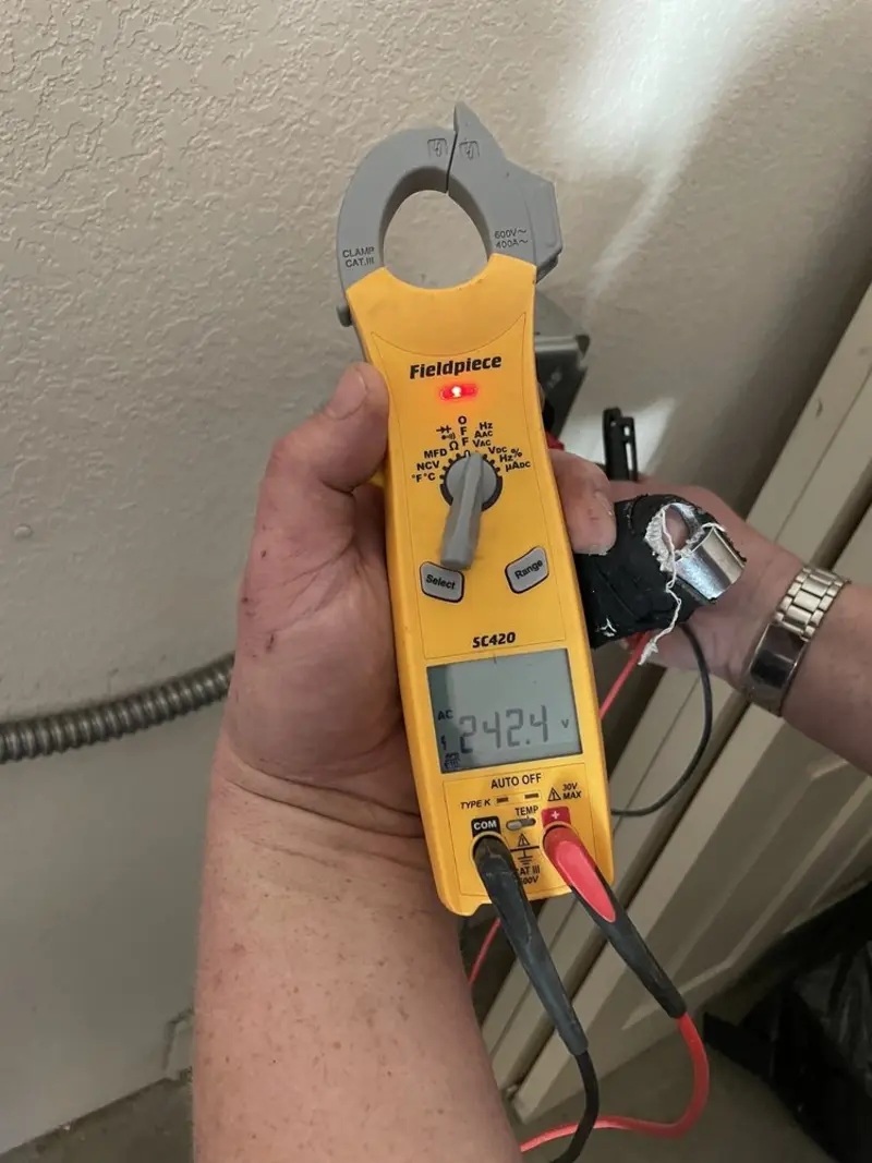 Voltage testing with clamp meter during Electrical Installation Services in Brisbane
